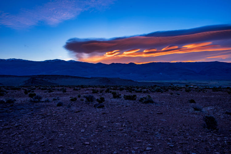 Sierra wave lenticular cloud at sunrise above white mountains owens valley, california, usa