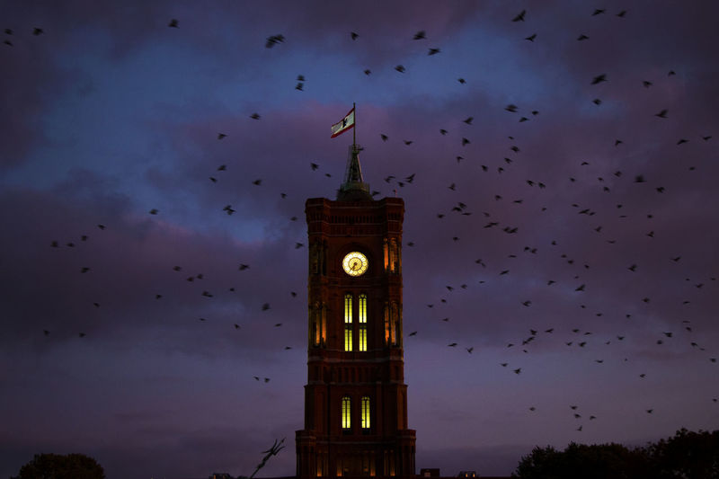 Berlin red clock tower at night