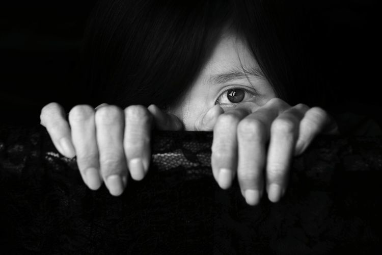 Close-up of woman hiding