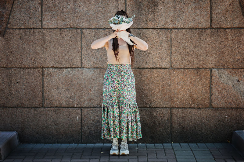 Contemporary modern trendy hipster bride in informal dress and sneakers with edible wedding bridal