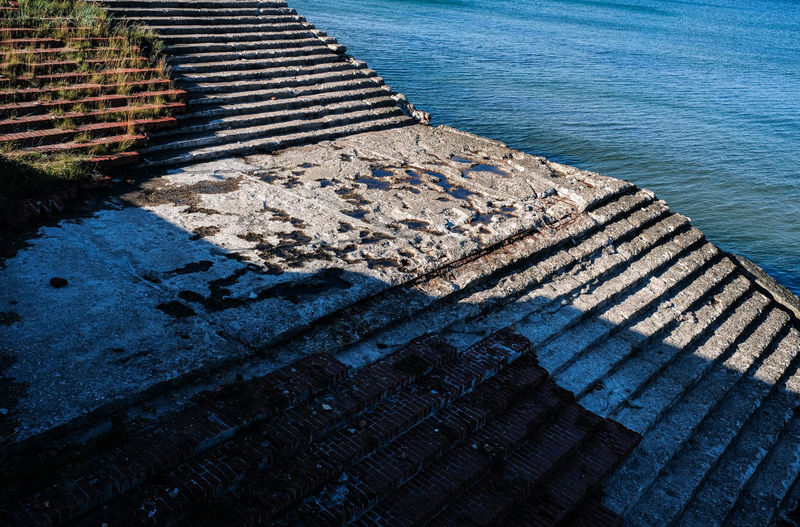 High angle view of staircase by sea