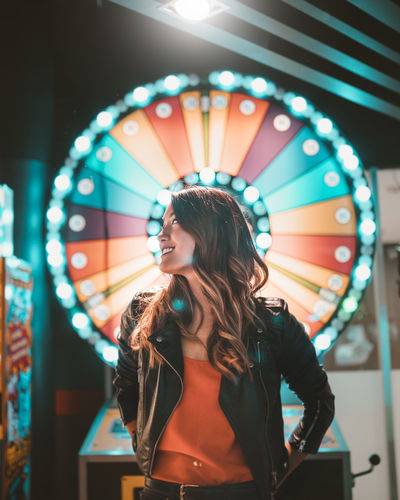 Woman standing in amusement park ride