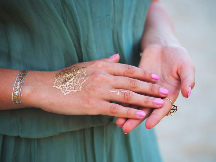 Close-up of woman hand with tattoo