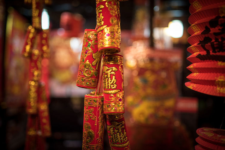 Close-up of red decoration hanging in temple