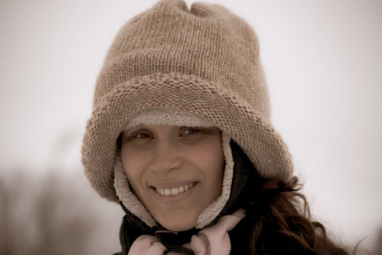 Portrait of smiling young woman wearing knit hat