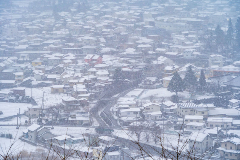 High angle view of snow covered townscape