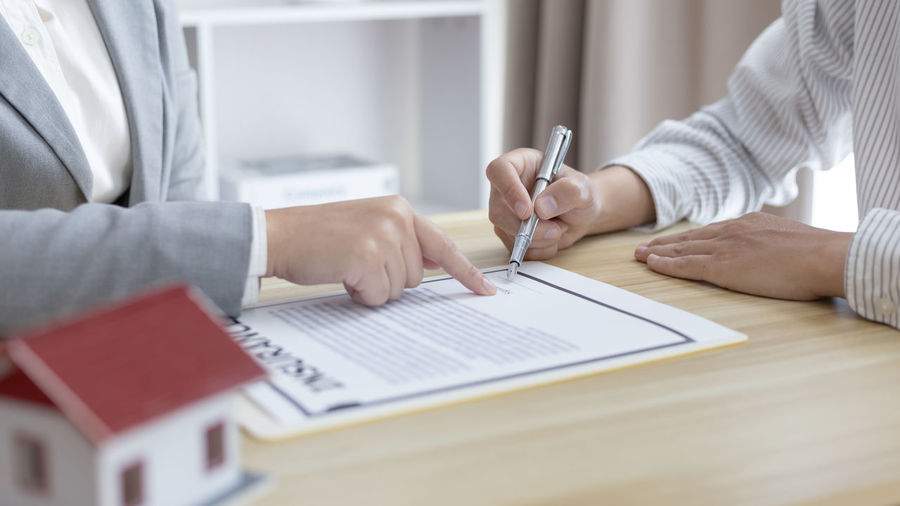 Midsection of businessman working at office