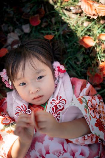 High angle portrait of cute girl with flowers