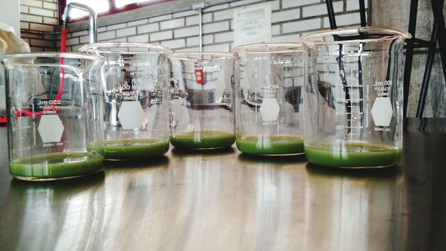 Close-up of drink in beakers on table