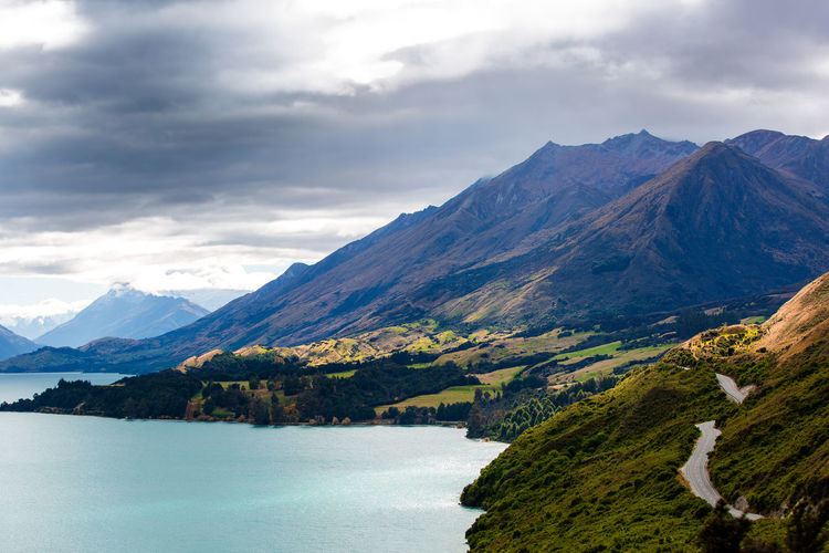 Scenic view of lake and mountains against sky