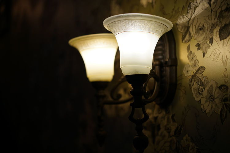 Close-up of illuminated lamps on wall