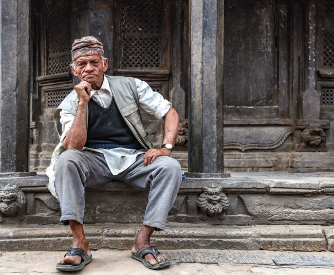 Portrait of senior man sitting outdoors