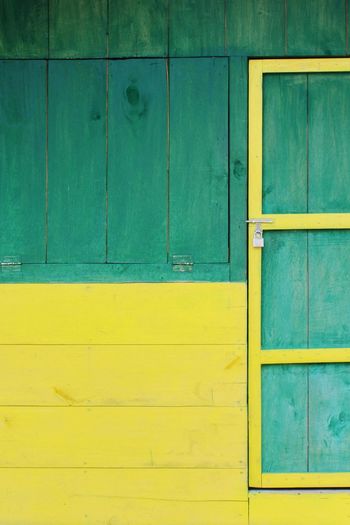 Full frame shot of wooden door on wall