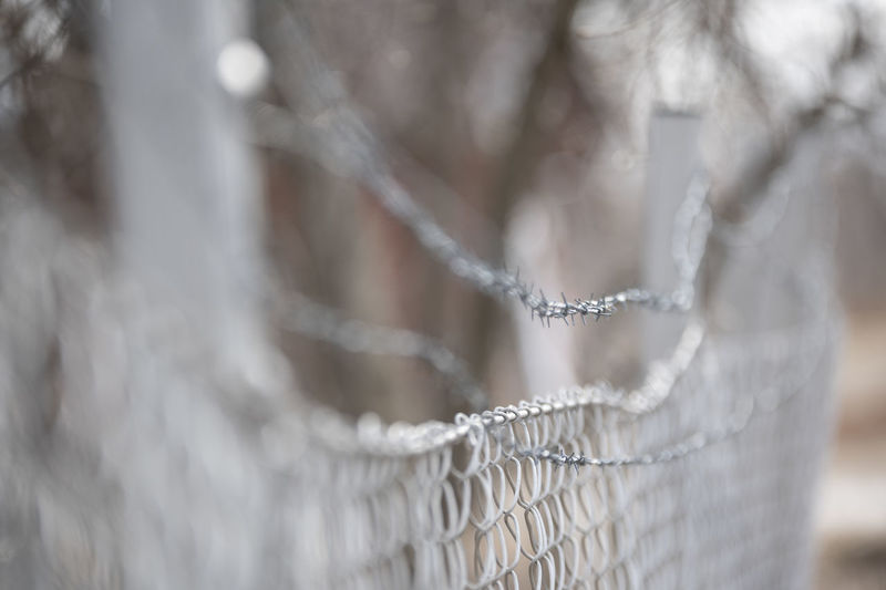 Close-up of rope fence during winter