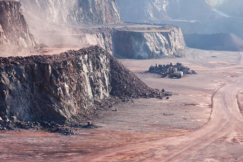 Empty open-pit mining against sky