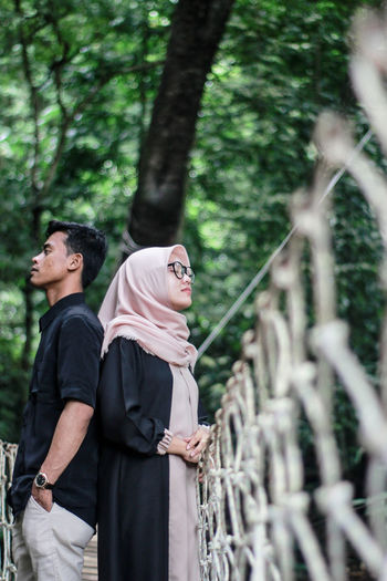 Young couple standing in forest