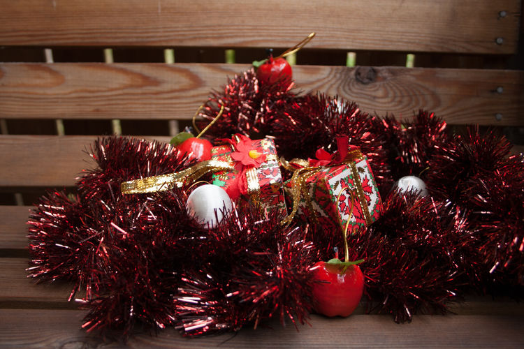 Close-up of christmas decoration material on bench