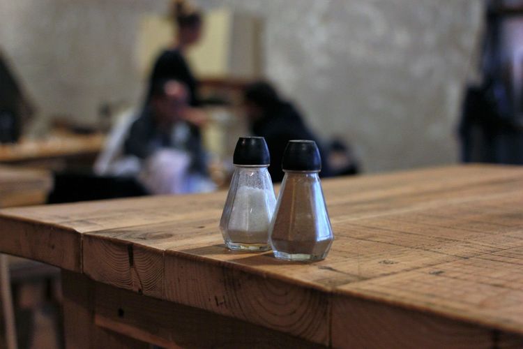 Salt and pepper shaker on table at restaurant