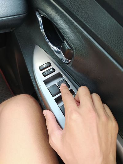 Close-up of hand holding car