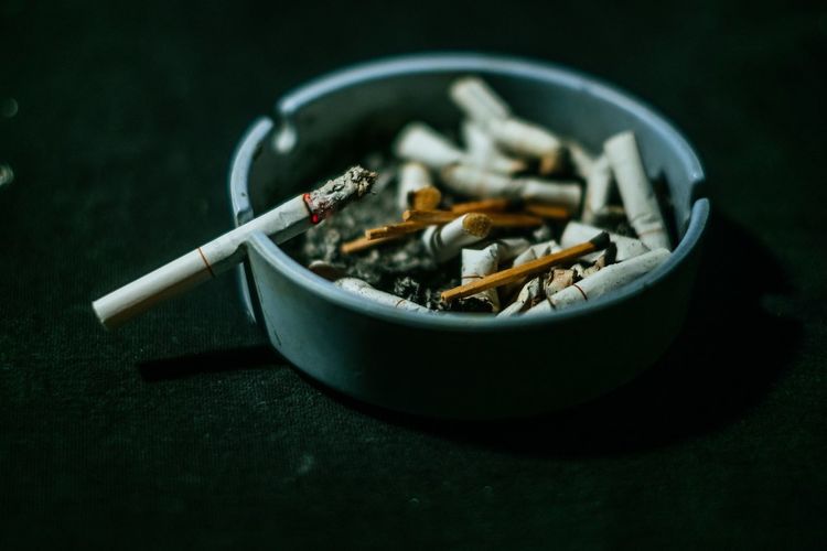 Close-up of cigarette in container