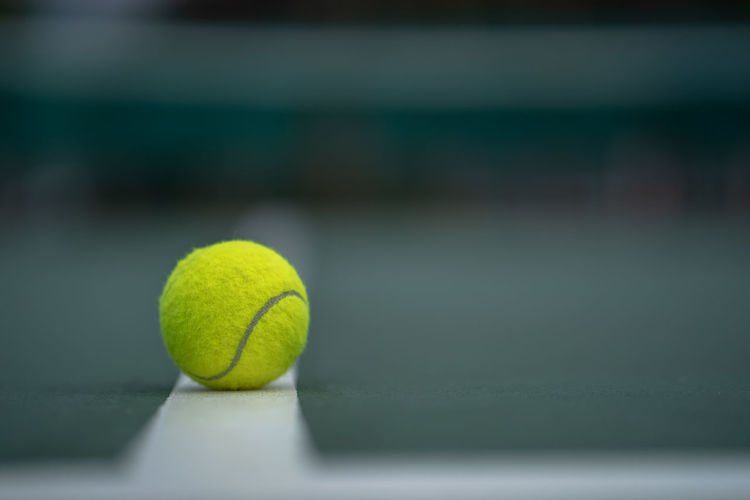 Close-up of tennis ball on field