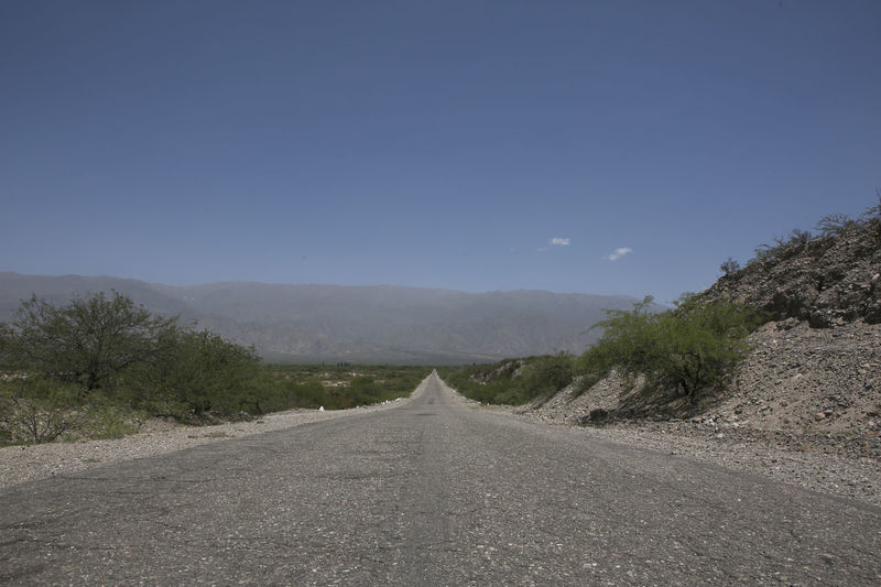 Road amidst landscape against sky