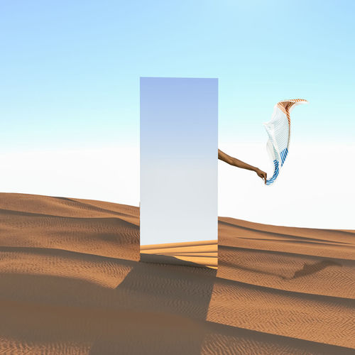 Digital composite image of woman against blue sky