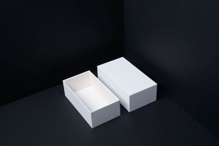 High angle view of white table against black background