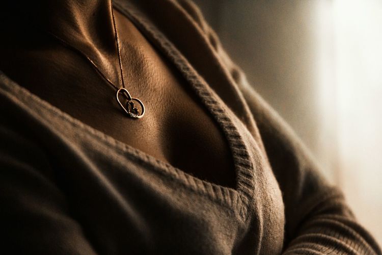 Close-up of woman wearing necklace