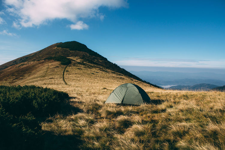 Tent on mountain against sky