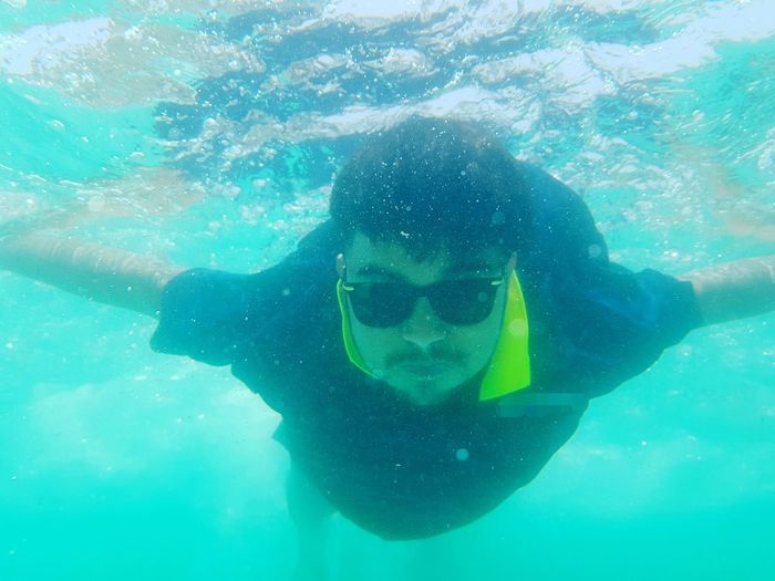 Portrait of man swimming in sea