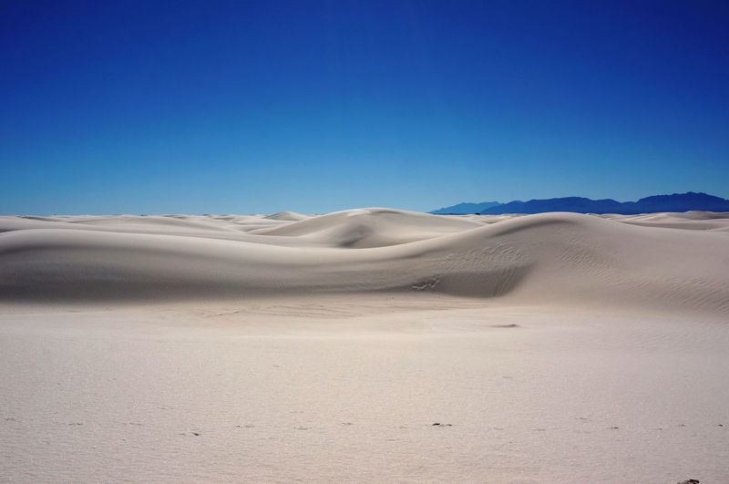 Idyllic view of white sands national monument against clear blue sky