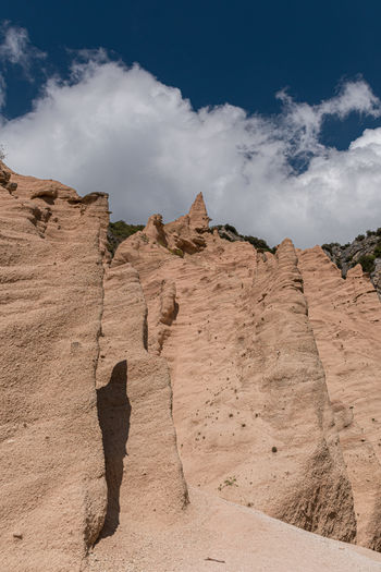 Peculiar red rocks with pinnacles and towers called lame rosse in the sibillini mountains