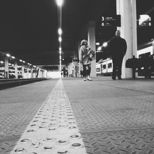 Full length of woman walking on sidewalk