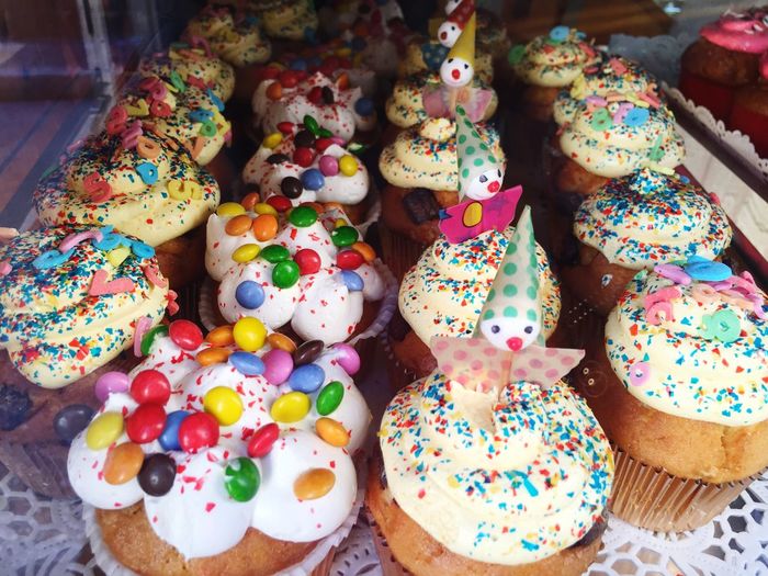 High angle view of fresh cupcakes on display at store