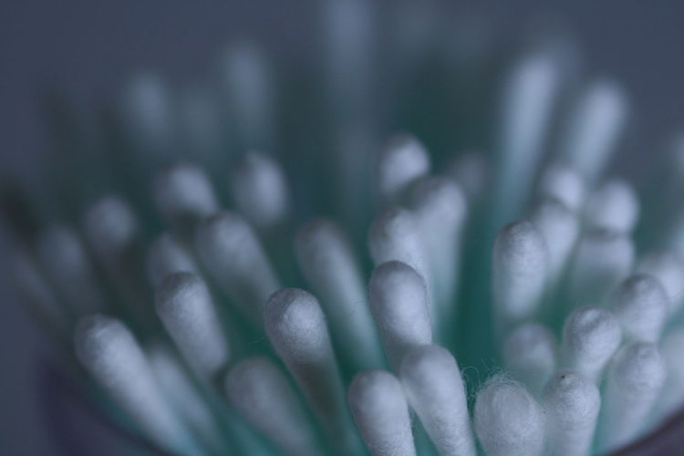 Close-up of cotton swabs in container