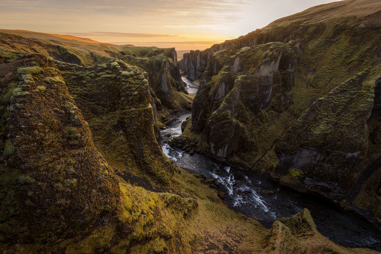 Scenic view of rock formation against sky during sunset