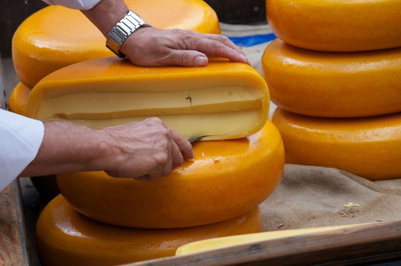 Man cutting cheese