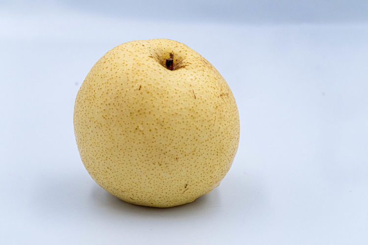 Close-up of apple against green background