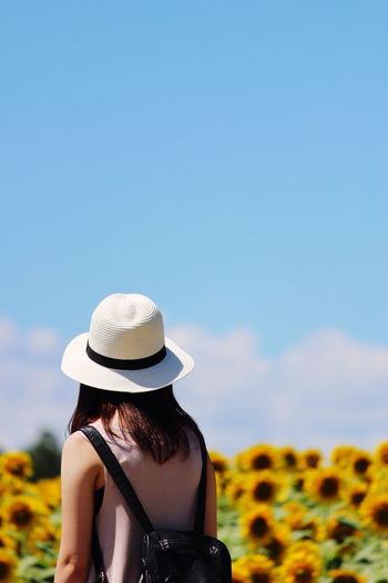 Rear view of girl looking at camera