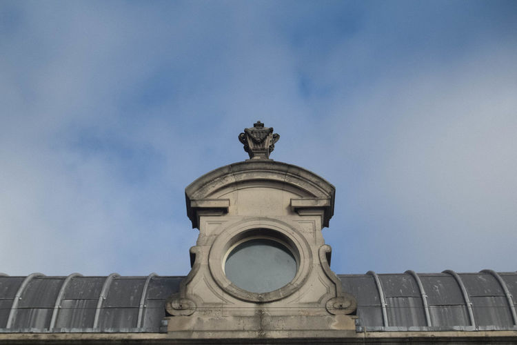 Low angle view of statue against building