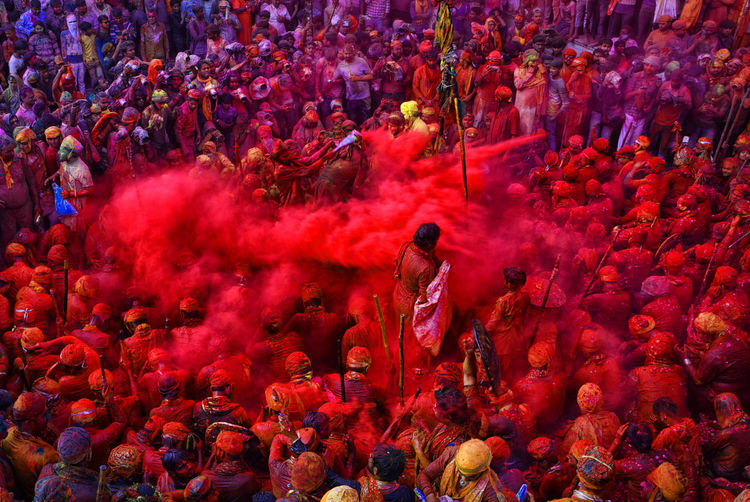 Hindu devotees play with colorful powdersat the radharani temple of nandgaon 