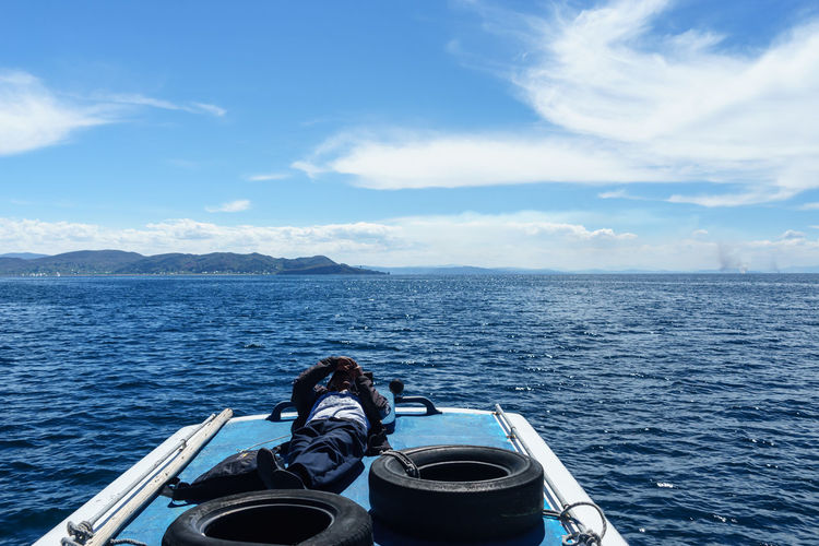 Cropped image of boat sailing in sea
