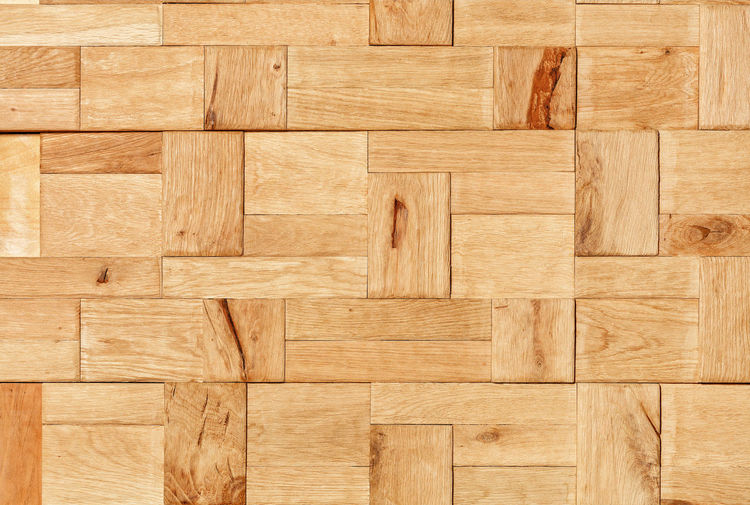 Beautiful mosaic of various rectangular wooden planks with a natural texture.