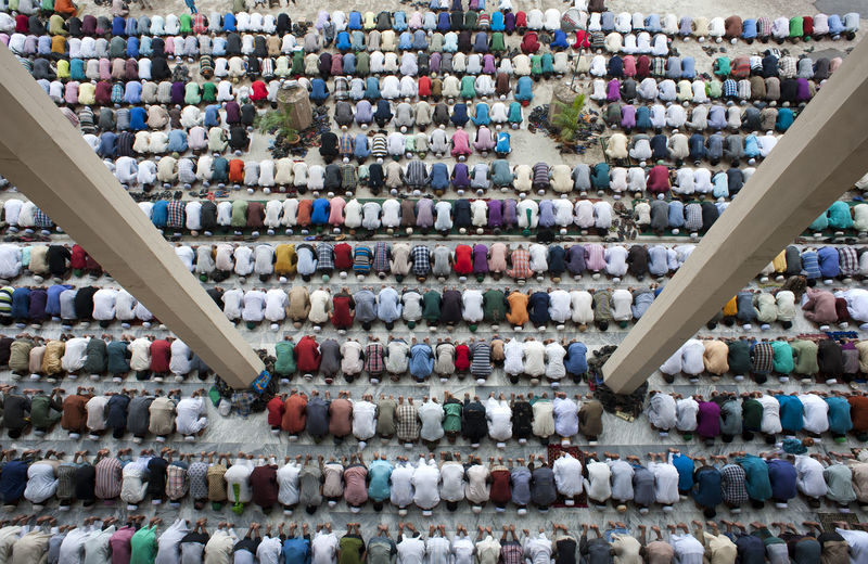 People are gathered to say their prayer at a Mosque named Jamiatul Falah in Chittagong, Bangladesh. Color Colorful Day Faith God God Is Great. Group Of People In A Row Islam Islamic Man Masque Multi Colored Namaz Organized People People And Places Photo Pias Shape Top View