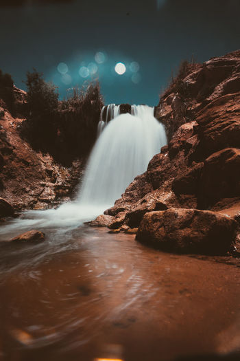 View of waterfall against sky