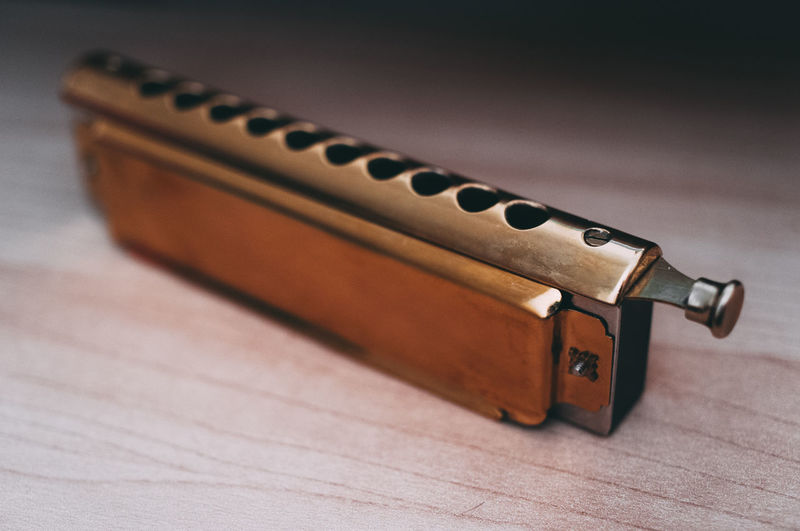 High angle view of harmonica on table