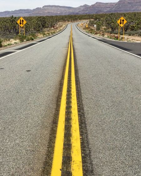High angle view of empty road with double yellow line