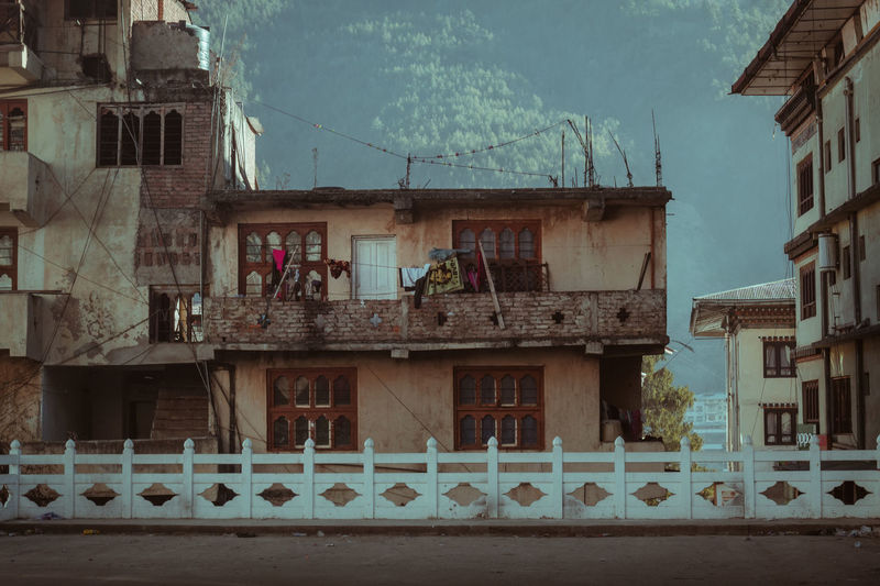 An old,  traditional house  near a street