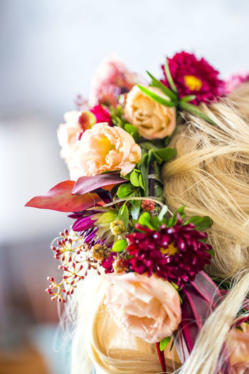 Cropped image of woman wearing flowers